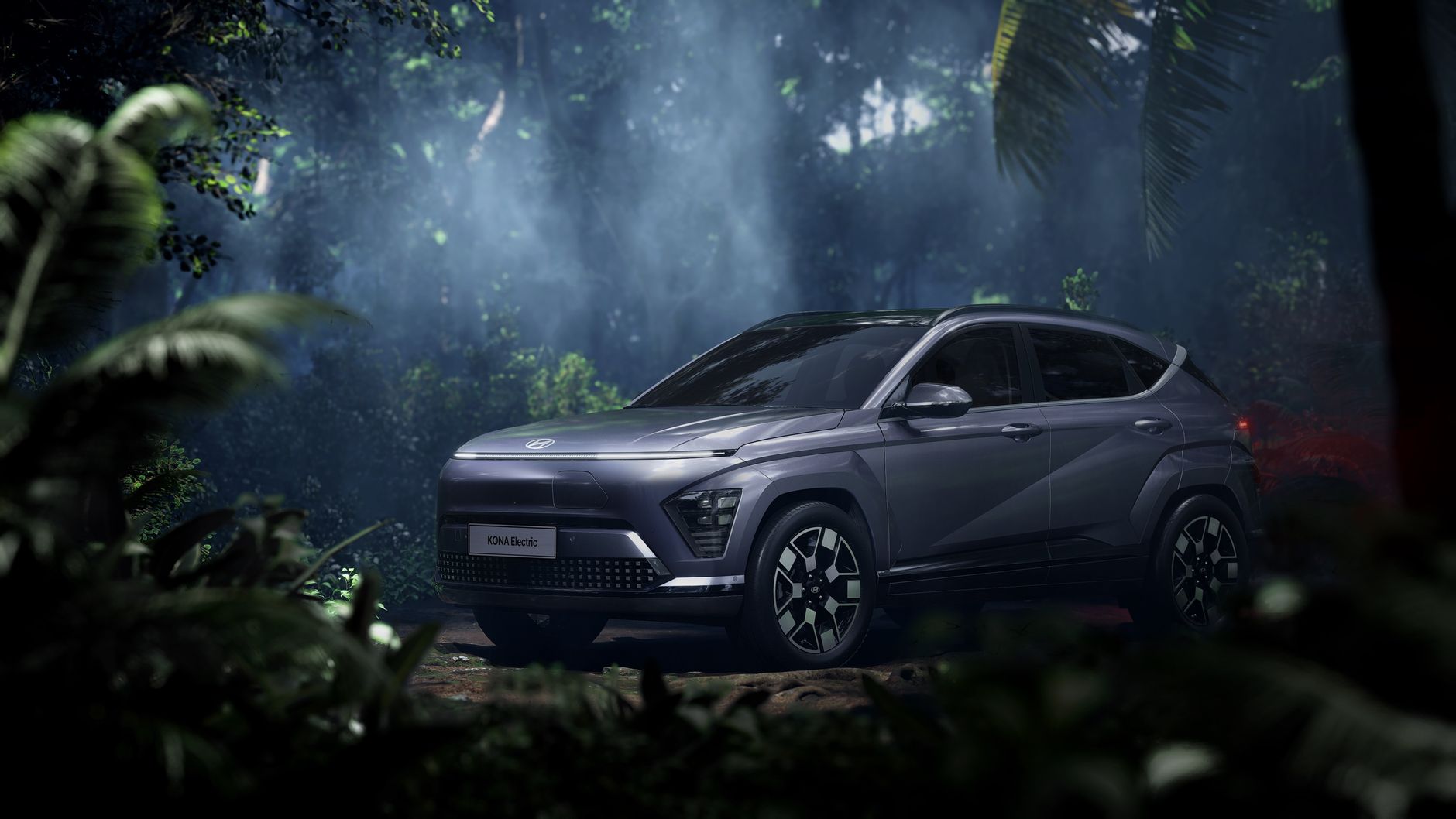 Hyundai Kona Electric SUV in a misty tropical forest setting, exuding adventure.