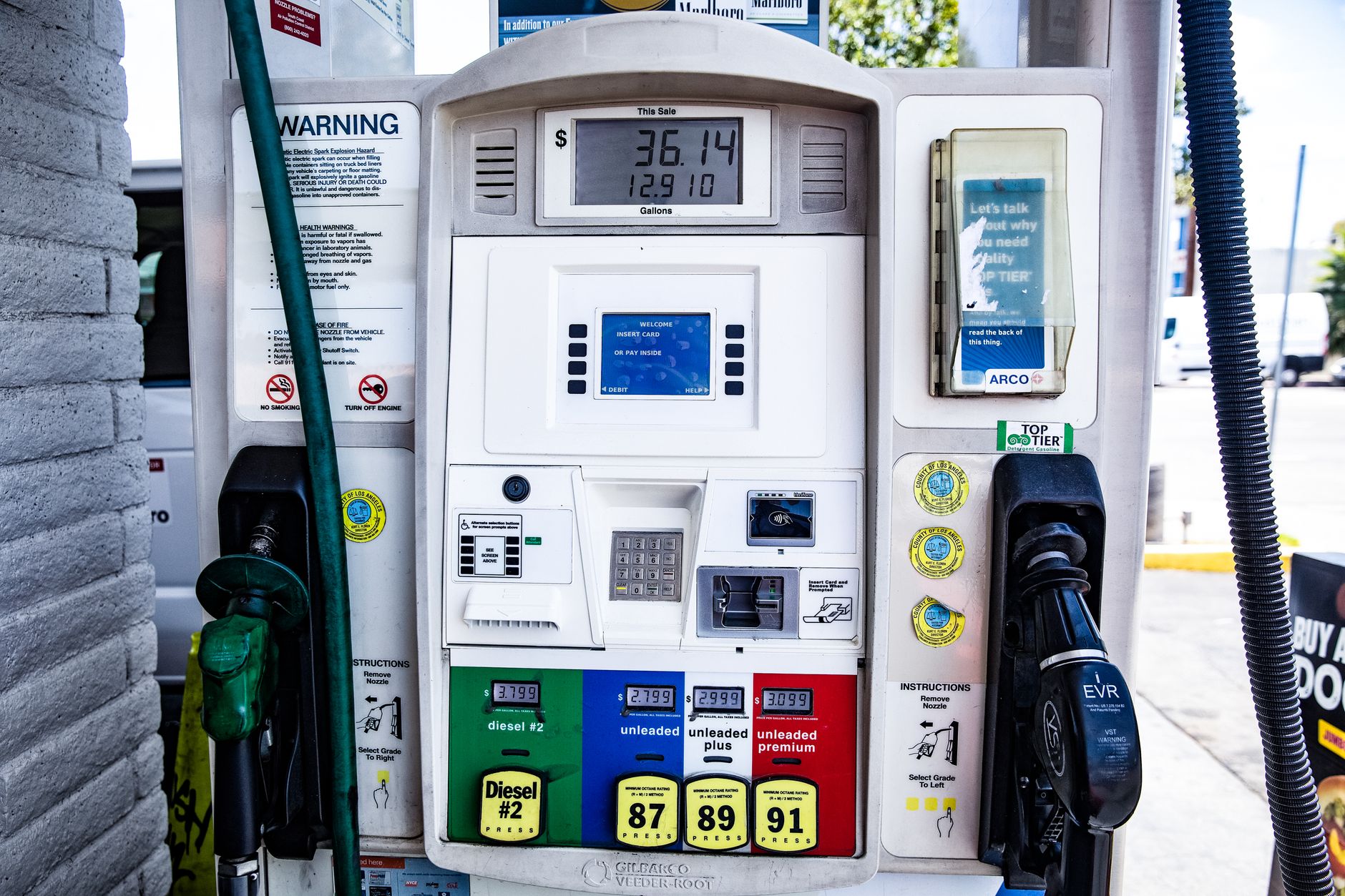 Close-up of a fuel pump showing gasoline and diesel options at a gas station in Los Angeles.