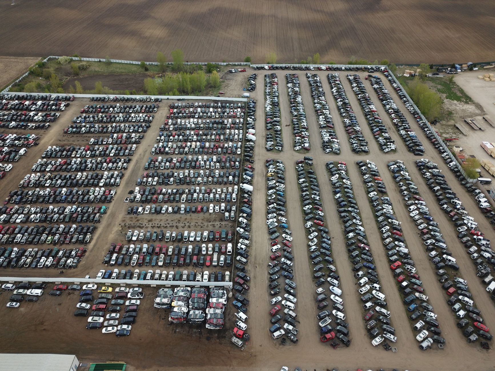 Aerial shot of a large vehicle storage or junkyard in Minnesota, USA.