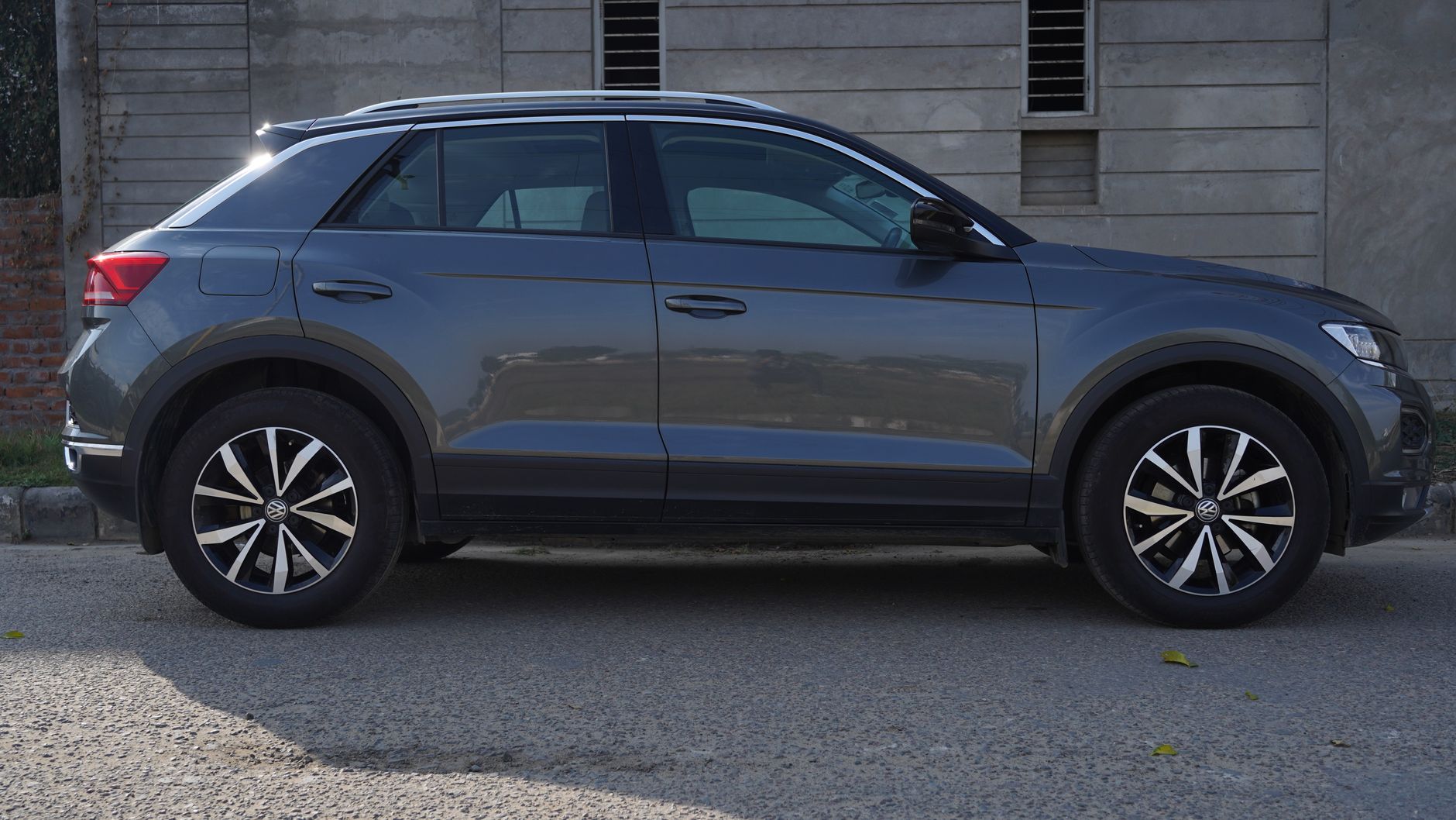 Side view of a grey Volkswagen T-Roc SUV parked outdoors in Ludhiana, India.